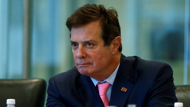 FILE PHOTO: Manafort of Republican presidential nominee Trump's staff listens during a round table discussion on security at Trump Tower in the Manhattan borough of New York