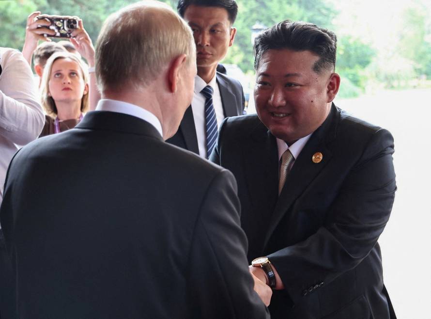 Russian President Vladimir Putin meets with North Korean leader Kim Jong Un in Beijing