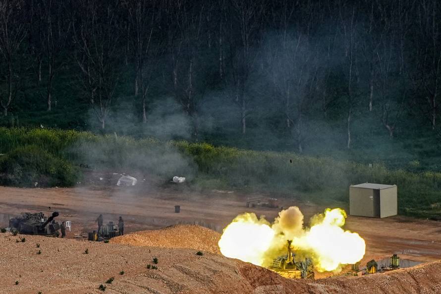 An Israeli artillery unit fires towards Lebanon, amid escalating hostilities between Israel and Hezbollah, as the U.S.-Israeli conflict with Iran continues, in northern Israel