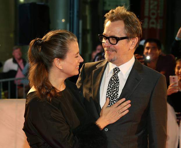 Actor Gary Oldman and his wife Gisele Schmidt arrive at the premiere of the film "Darkest Hour" at Toronto International Film Festival.