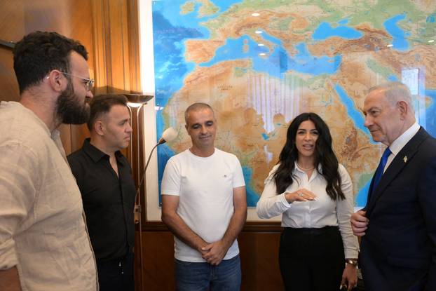 Israeli Prime Minister Benjamin Netanyahu meets "heroes" who intervened on a flydubai flight bound to Israel from the United Arab Emirates, in Jerusalem