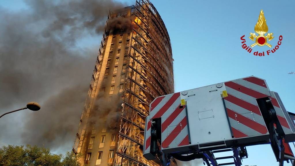 Fire rages through Milan residential tower block