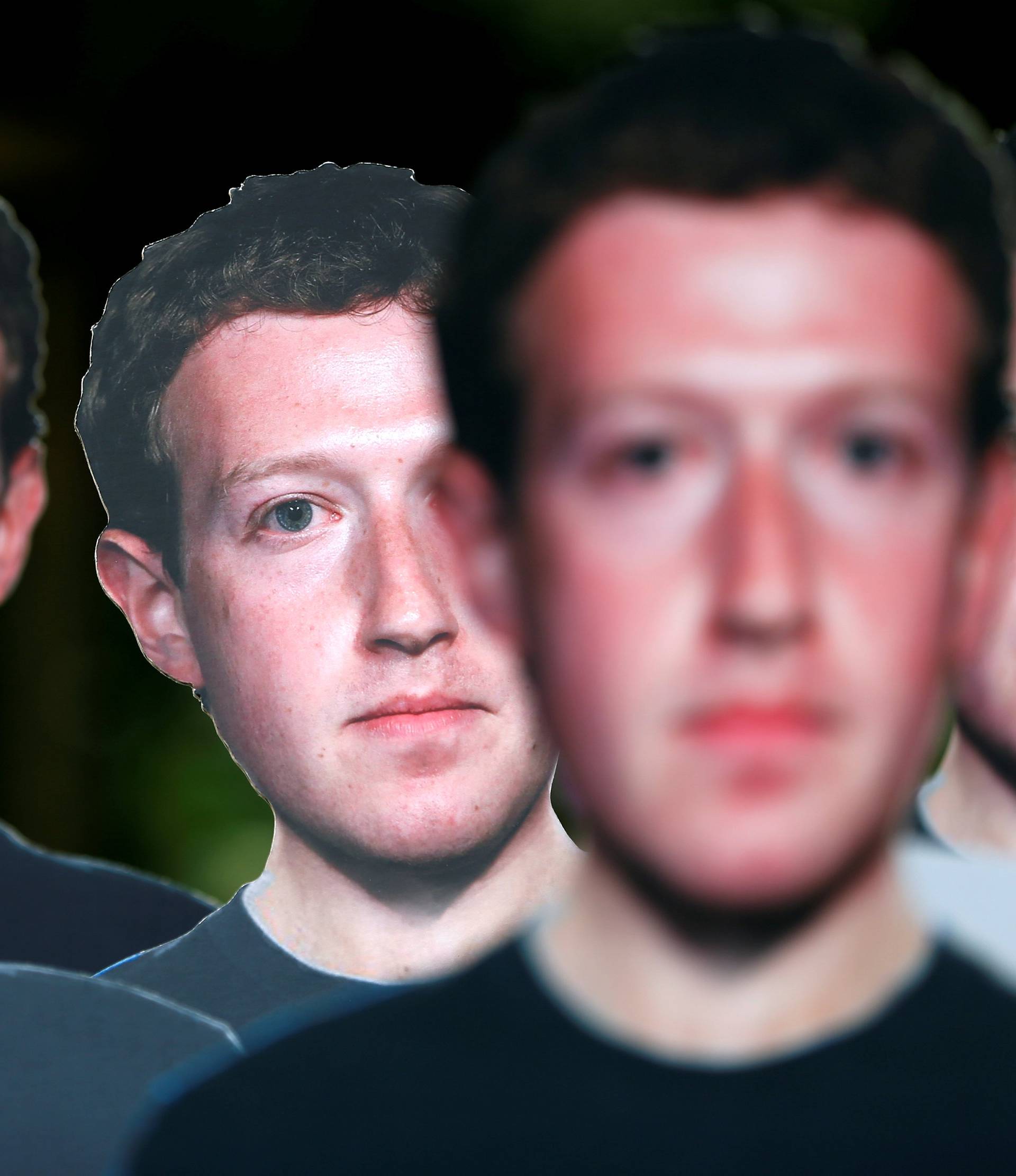 Cardboard cutouts depicting Facebook CEO Zuckerberg are pictured during a demonstration in Brussels