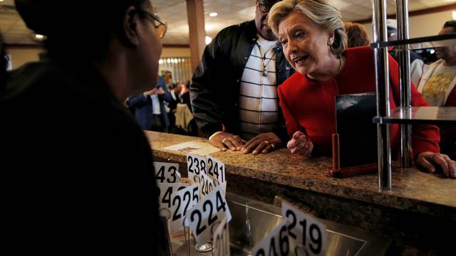 U.S. Democratic presidential nominee Hillary Clinton places an order at Angie's Soul Cafe in Cleveland