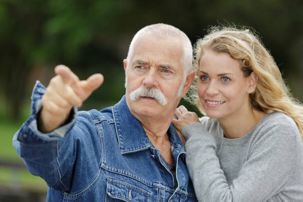 a family pointing at something