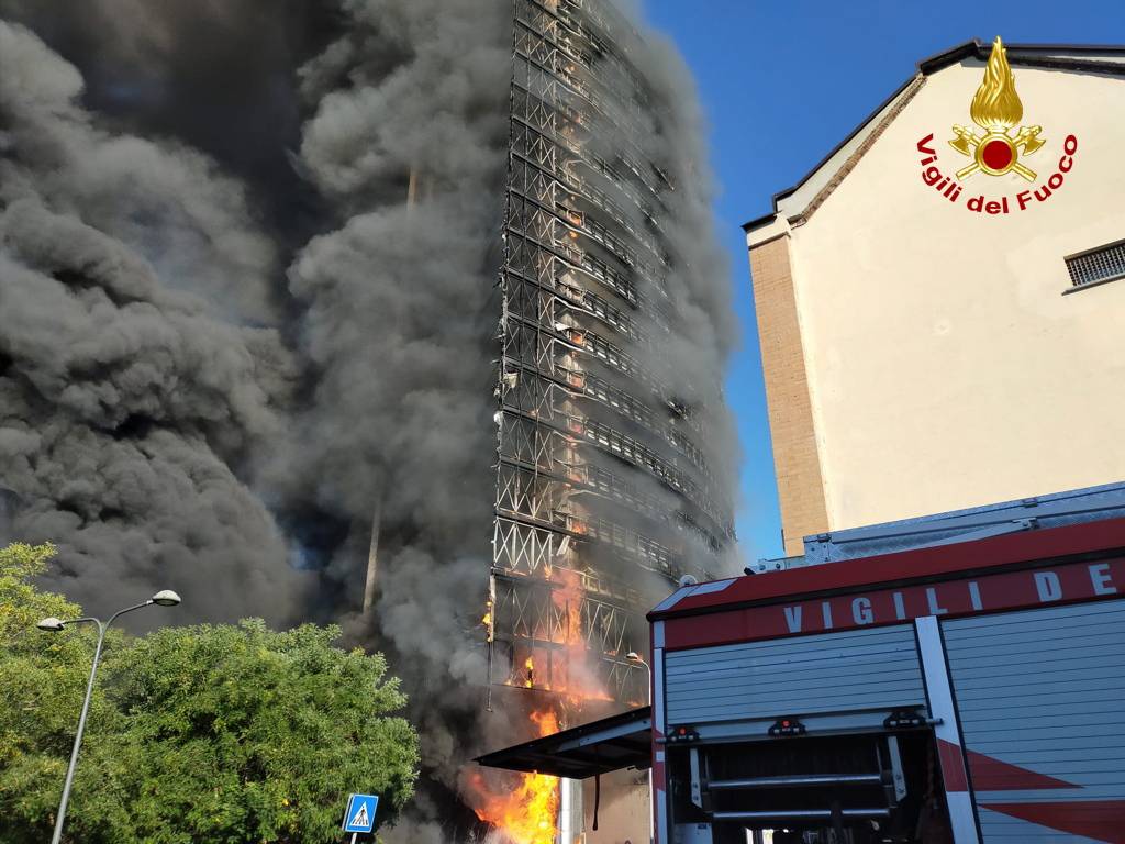 Fire rages through Milan residential tower block