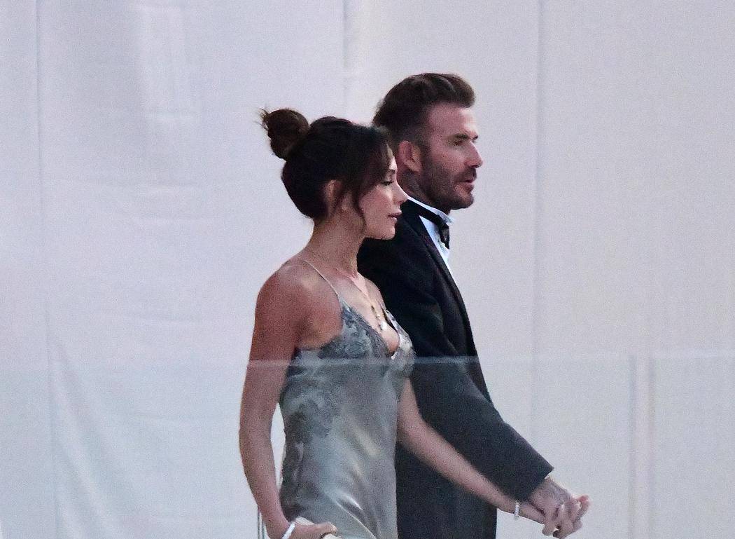 David Beckham and his wife Victoria Beckham enter the dinner tent after their son Brooklyn married Nicola Peltz in Palm Beach