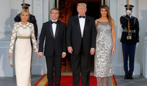 U.S. President Trump and first lady Melania welcome French President Macron and his wife for a State Dinner at the White House in Washington