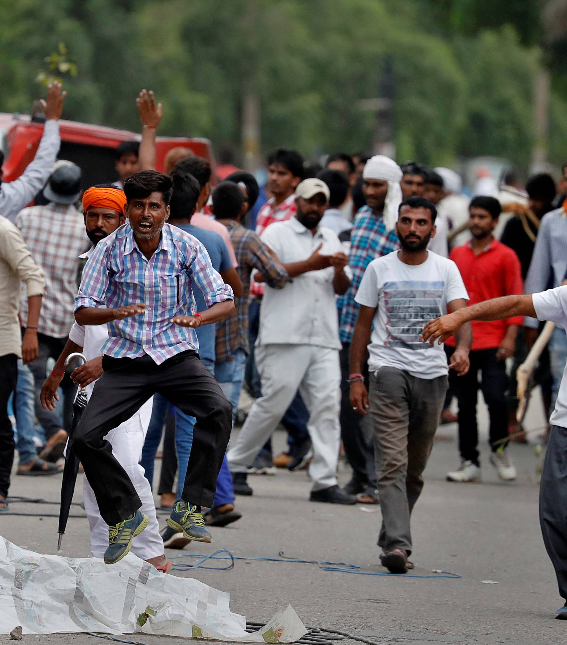 Protestors react during violence in Panchkula