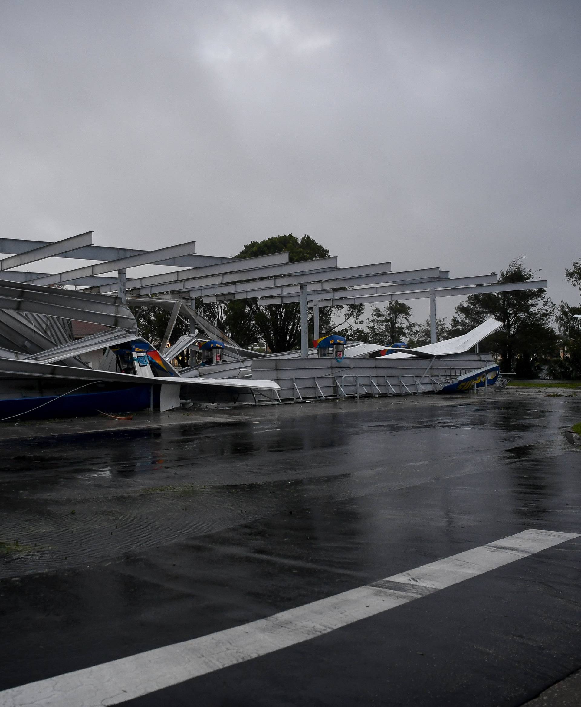 The crumbled canopy of a gas station damaged by Hurricane Irma is seen in Bonita Springs