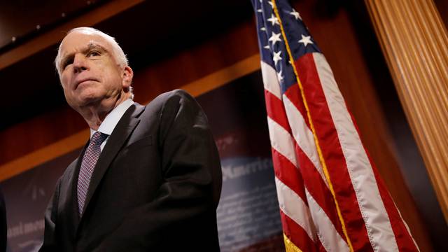 FILE PHOTO:    Senator John McCain (R-AZ) looks on during a press conference about his resistance to the so-called "Skinny Repeal" of the Affordable Care Act on Capitol Hill in Washington