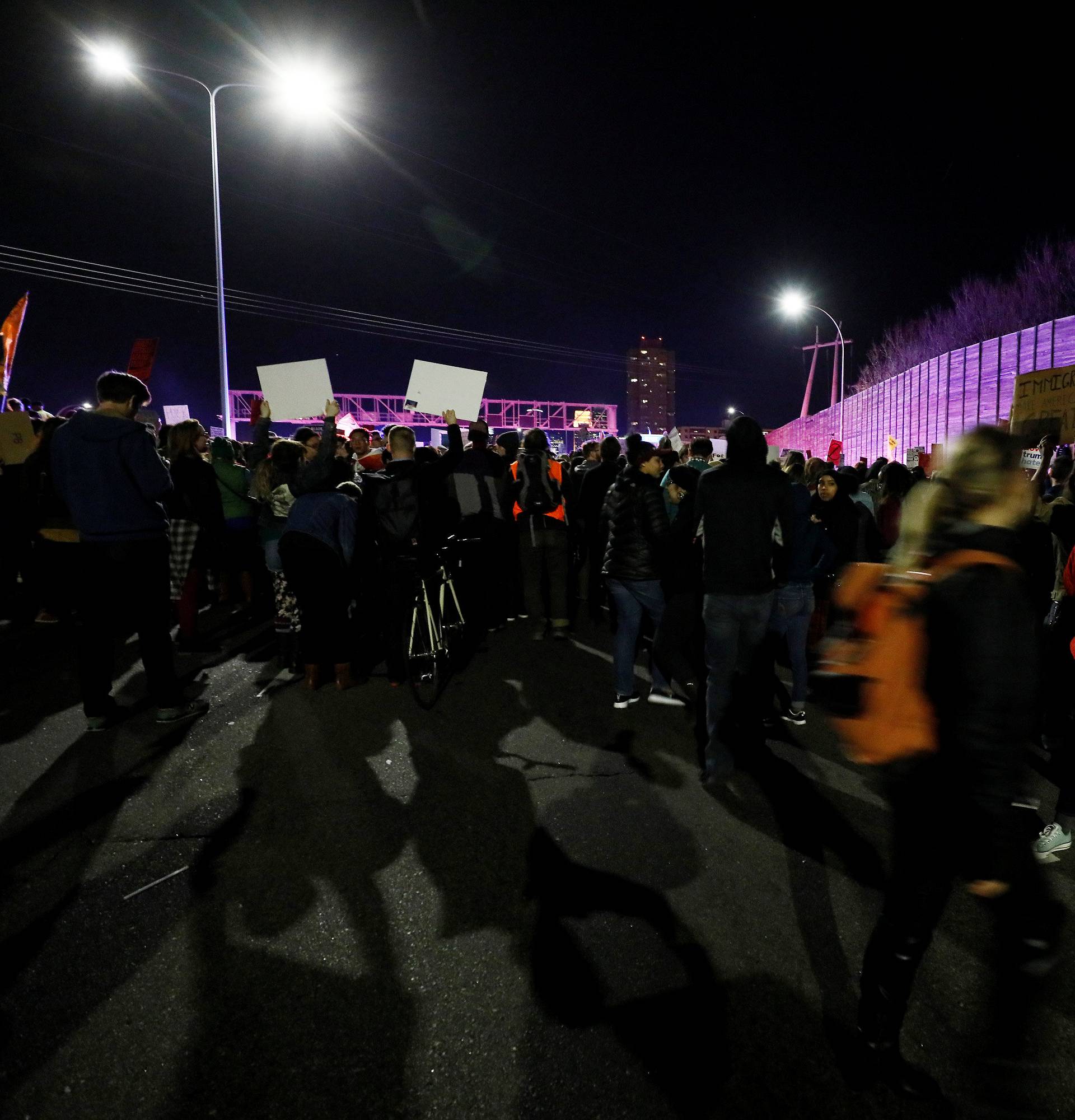 Demonstrators march as they shout slogans against President-elect Donald Trump in Minneapolis