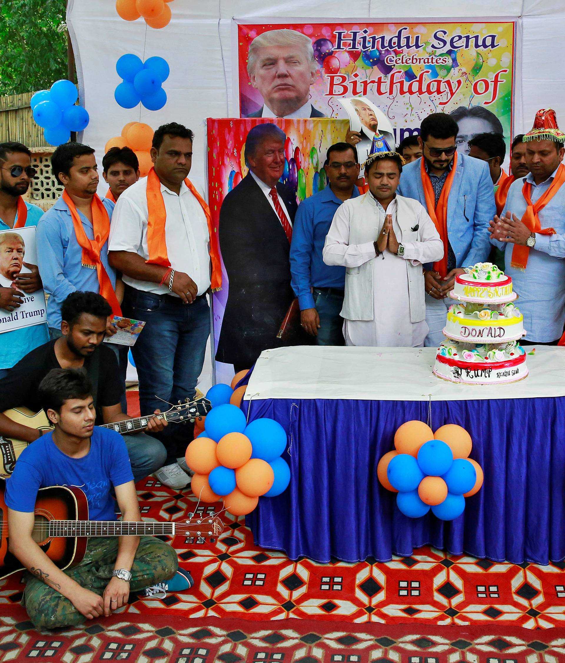 Members of Hindu Sena, a right wing Hindu group, celebrate U.S. Republican presidential candidate Donald Trump's birthday in New Delhi