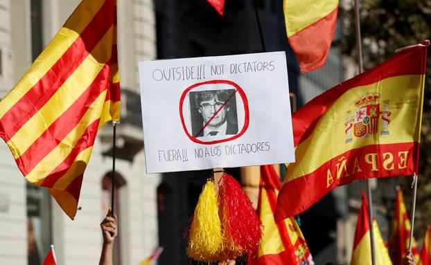 Pro-unity supporters take part in a demonstration in central Barcelona