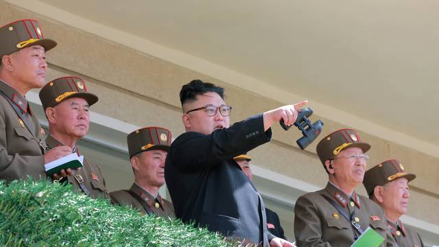 North Korean Leader Kim Jong Un observes a target-striking contest by the Korean People's Army
