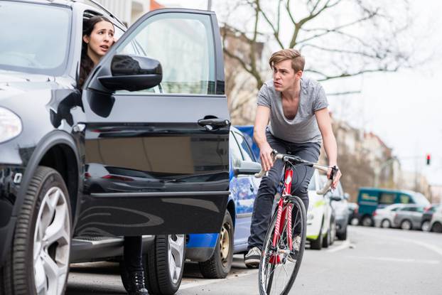 Angry,Young,Bicyclist,Shouting,While,Swerving,For,Avoiding,Dangerous,Collision