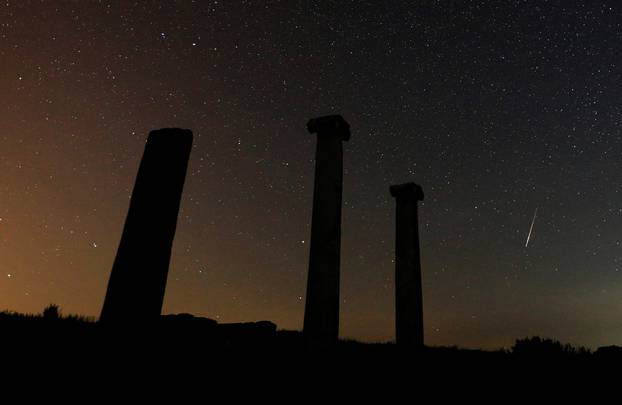 A long exposure shot shows stars and meteors over the columns in the ancient city of Stobi near Stip