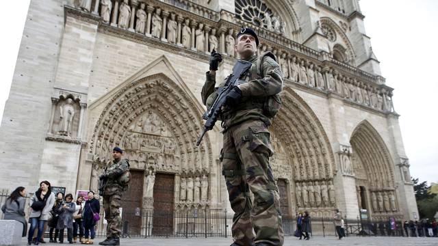 Soldiers patrol in front of the Notre Dame Cathedral in Paris