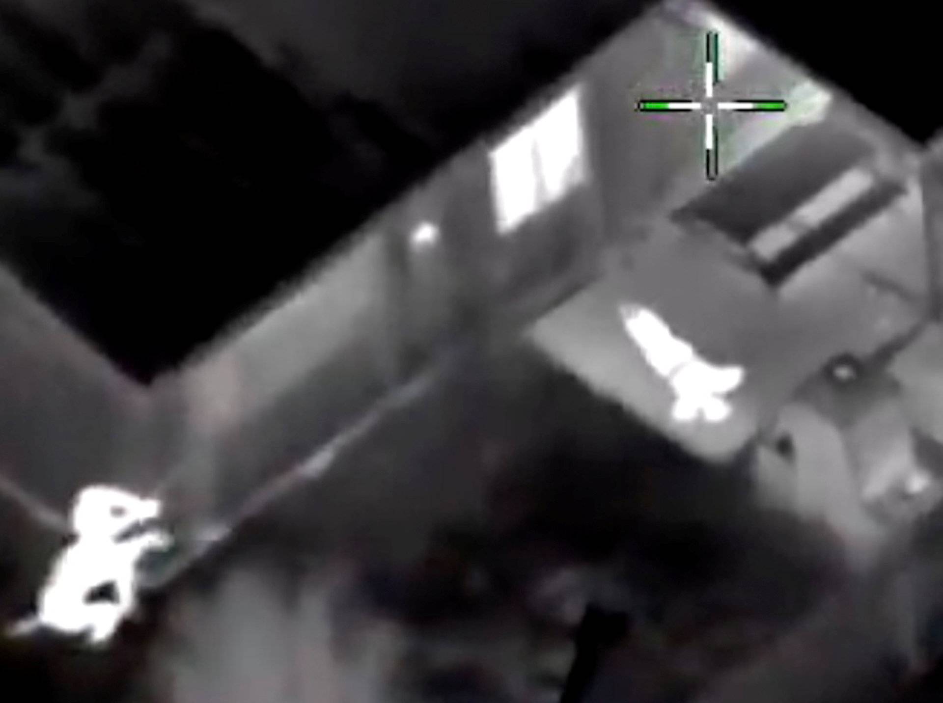 Stephon Clark is visible on the ground as two police officers shoot him, in this still image captured from police aerial video footage released by Sacramento Police Department