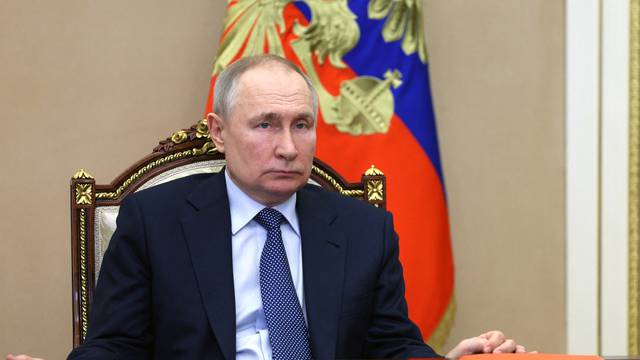 Russian President Vladimir Putin cattends a Security Council meeting in Moscow