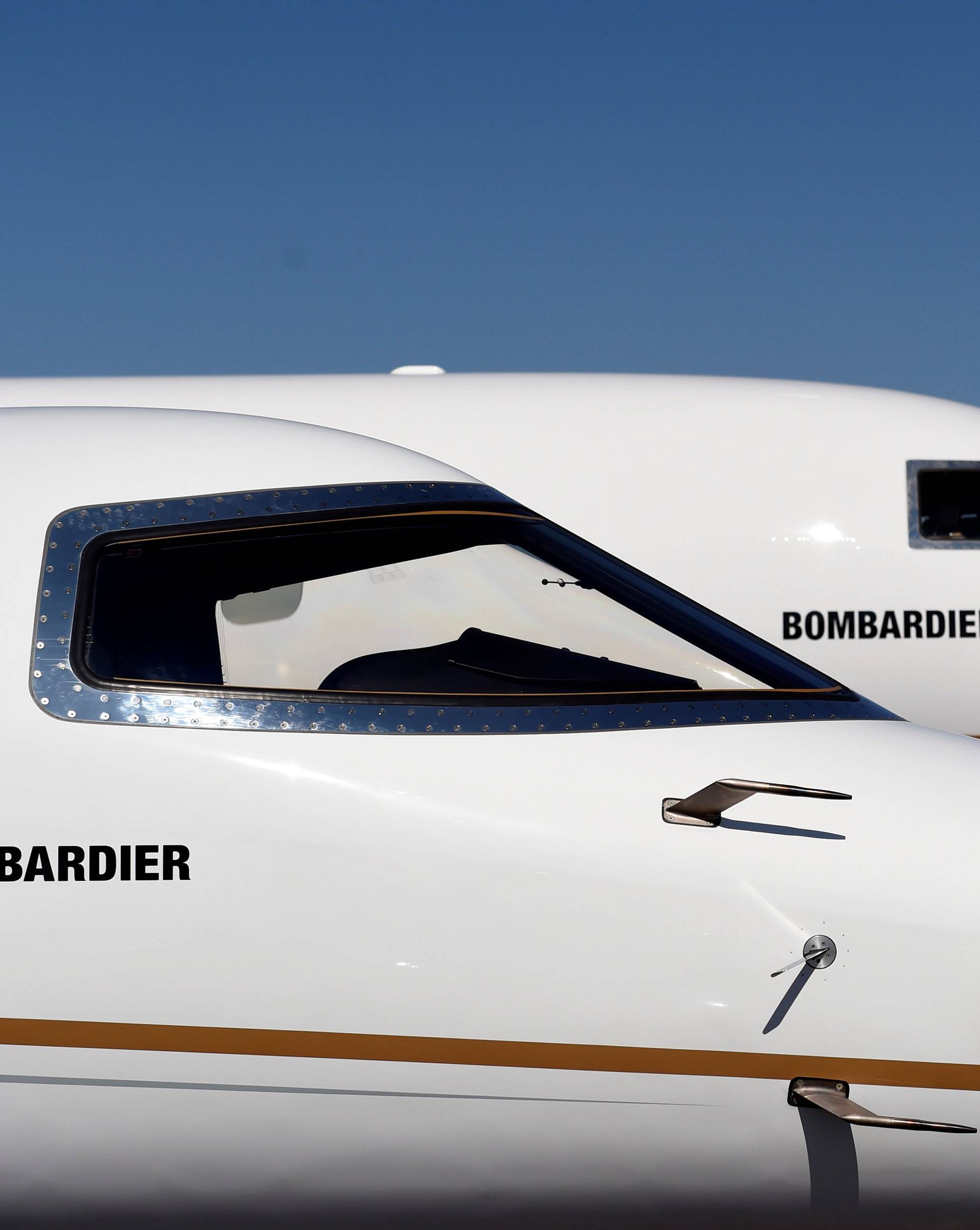 Bombardier's new Global 7000 business jet is seen parked next to a Learjet 75 during the National Business Aviation Association at the Henderson Executive Airport in Henderson