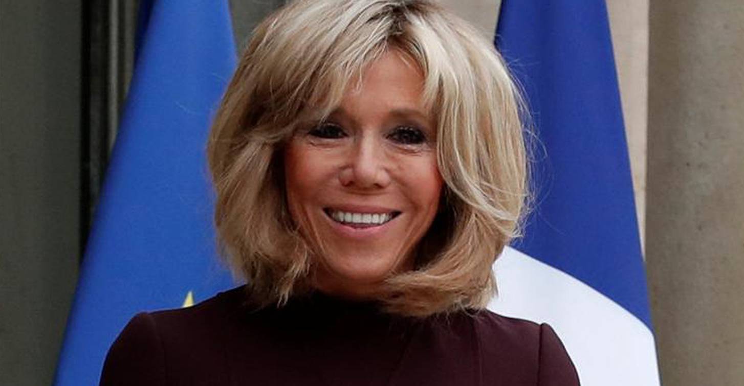 Brigitte Macron, wife of the French President, waits to welcome guests at the Elysee Palace in Paris