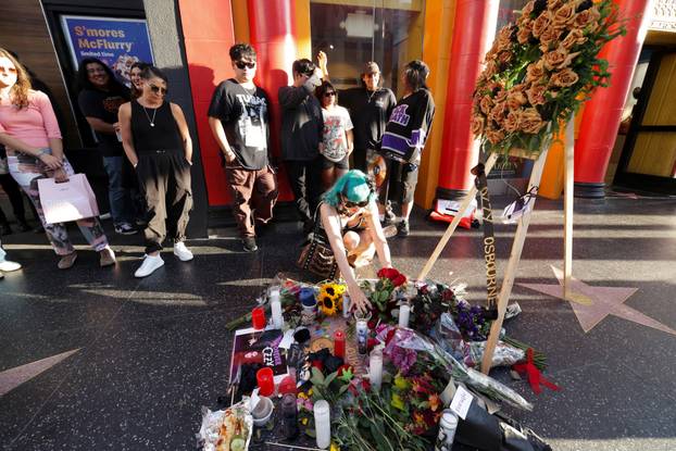 Flowers and pictures are placed on the star of late Ozzy Osbourne at the Hollywood Walk of Fame in Los Angeles