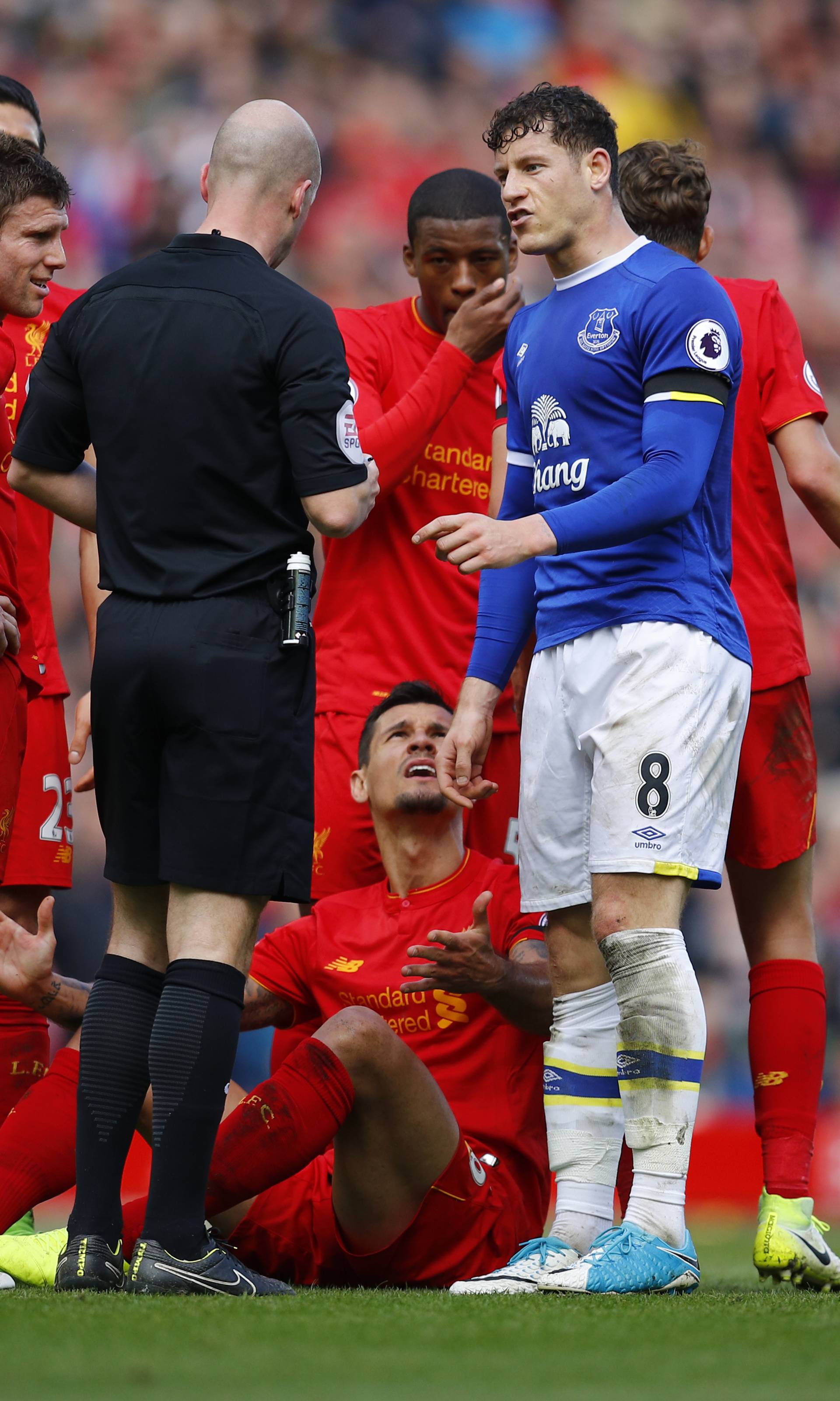 Referee Anthony Taylor talks to Everton's Ross Barkley after his foul on Liverpool's Dejan Lovren
