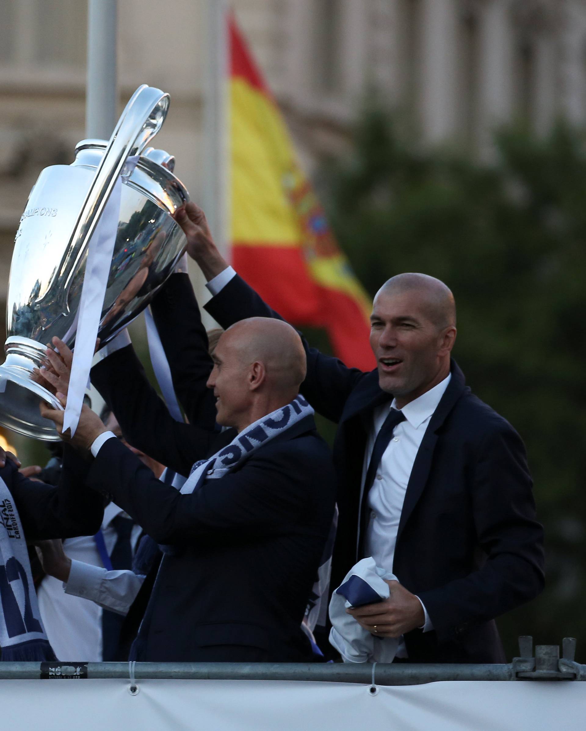 Real Madrid's coach Zidane and his staff celebrate Champions League title at Cibeles Fountain in Madrid
