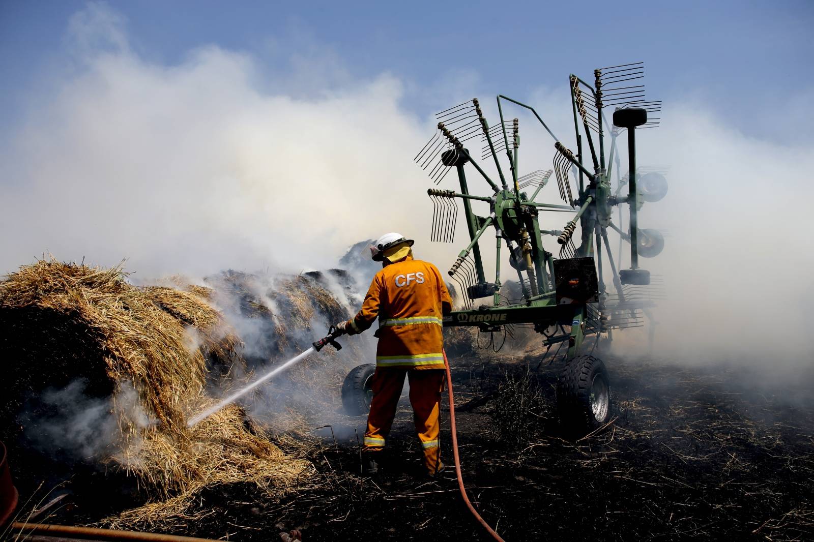 Country Fire Service (CFS) members put out a fire which reached hay bales on a property at Mount Torrens in the Adelaide Hills