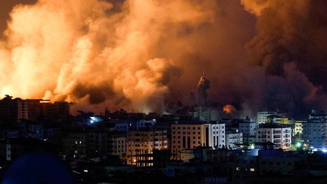 Flames and smoke billow during Israeli strikes in Gaza