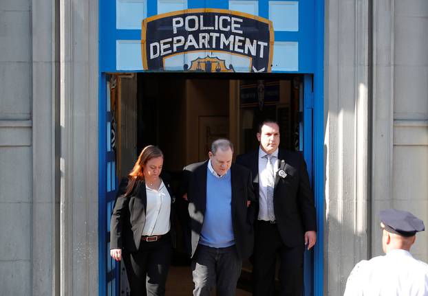 Film producer Harvey Weinstein leaves the 1st Precinct in Manhattan in New York
