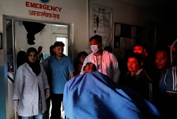 An injured man at a hospital for treatment following a flash flood at Trishuli, Nepal