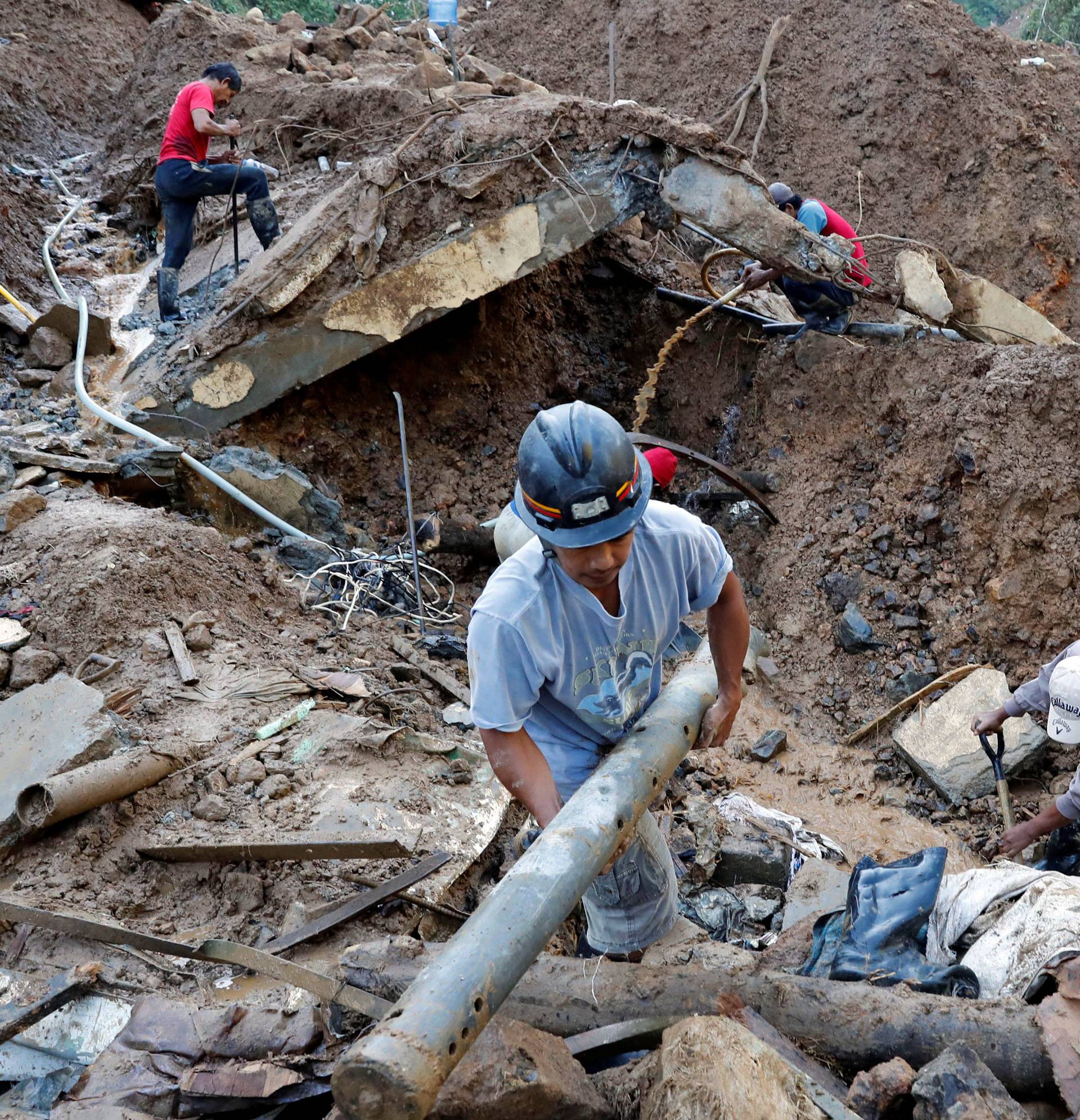 Rescuers continue their search for missing miners in a landslide caused by Typhoon Mangkhut at a small-scale mining camp in Itogon