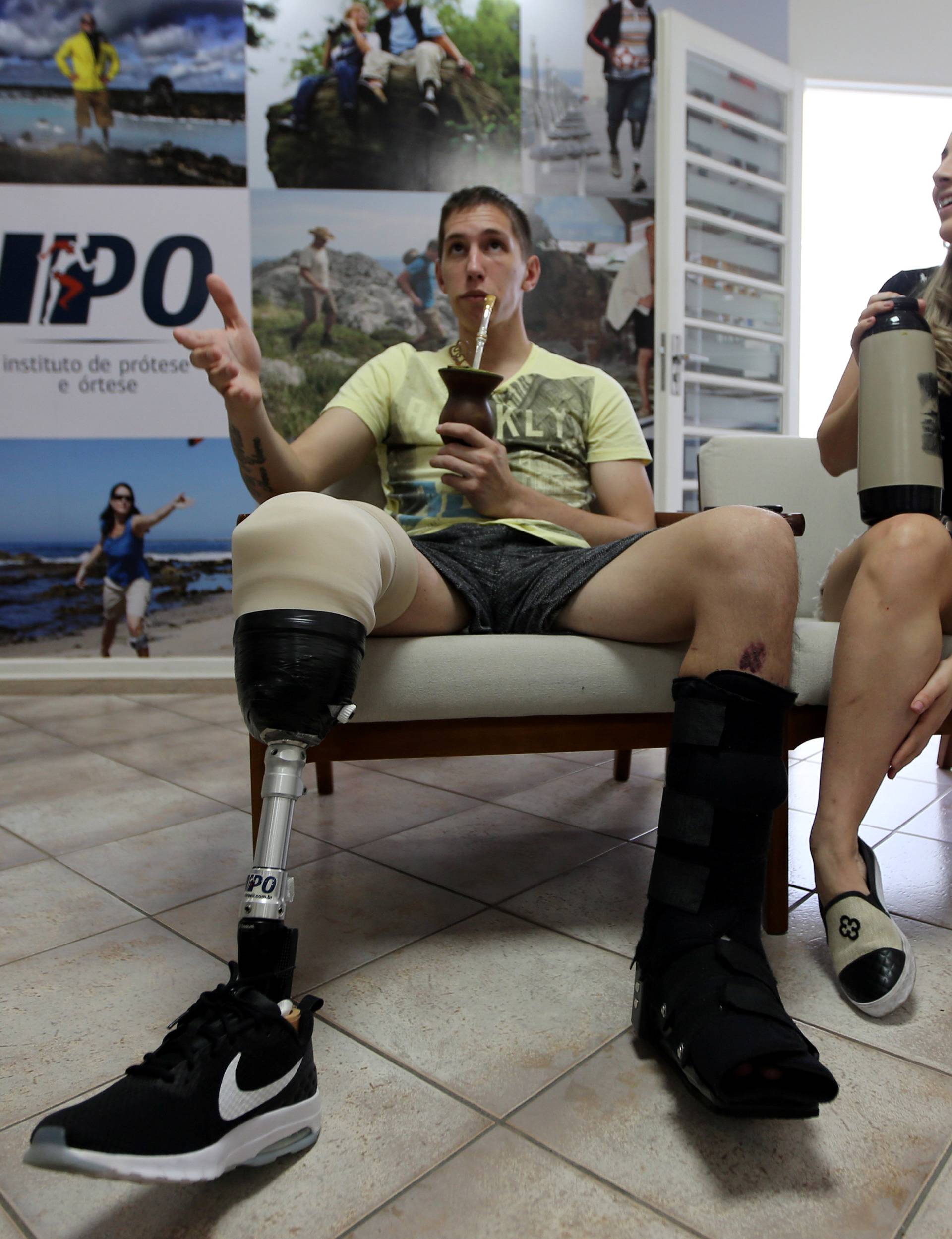 Goalkeeper Jackson Follmann, who survived when the plane carrying Brazilian soccer team Chapecoense crashed, and his girlfriend Andressa Perkovski talk to media in Sao Paulo