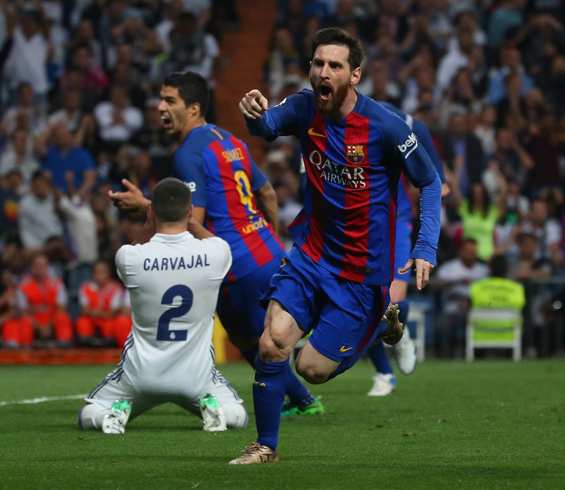 Barcelona's Lionel Messi celebrates scoring their third goal