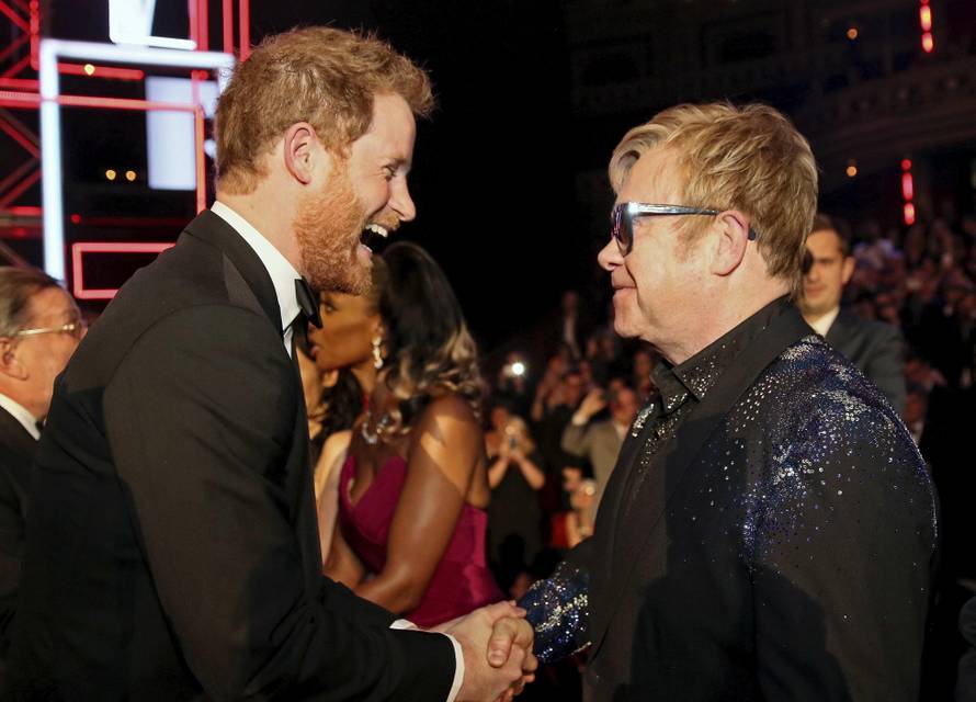 Britain's Prince Harry greets Elton John after the Royal Variety Performance at the Albert Hall in London