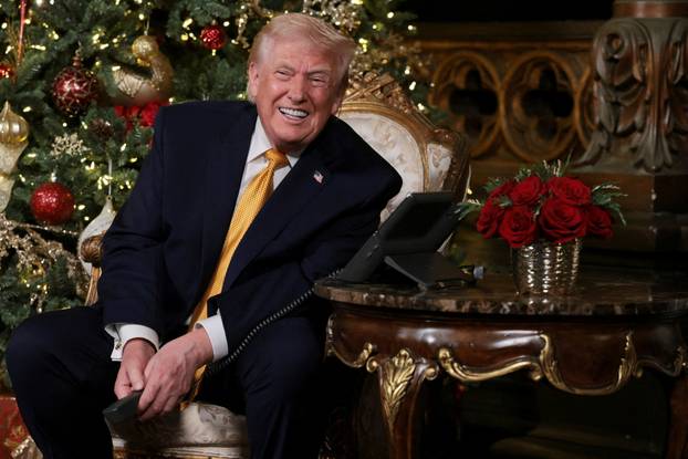 U.S. President Trump participates in NORAD Santa tracker phone calls, from the Mar-a-lago club in Palm Beach