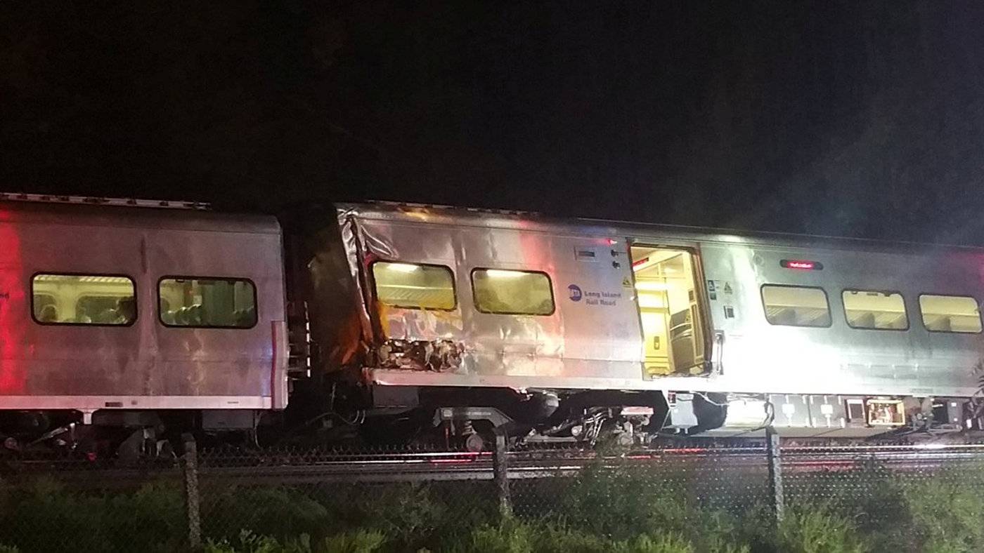 A train sits derailed near the community of New Hyde Park on Long Island in New York