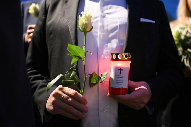 People gather to commemorate of Charlie Kirk in front of the Embassy of the United States in Berlin