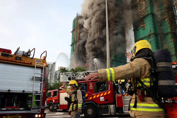 Flames engulf bamboo scaffolding across multiple buildings at Wang Fuk Court housing estate, in Tai Po
