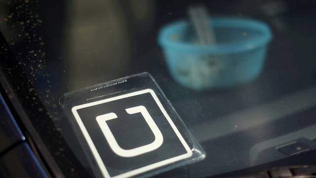 FILE PHOTO - An Uber car is seen parked with the driver's lunch left on the dashboard in Venice California