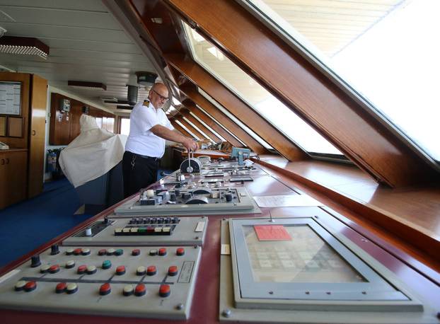 A captain inspects the yacht called "Basrah Breeze", once owned by a former Iraqi president Saddam Hussein, who was toppled in a U.S.-led invasion in 2003, in the southern port of Basra