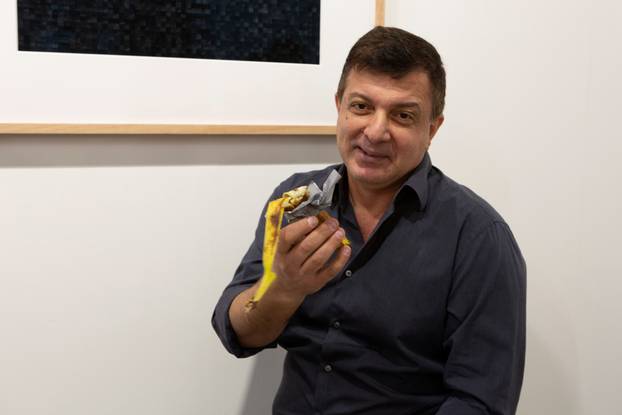 David Datuna shows the remains of the artwork 