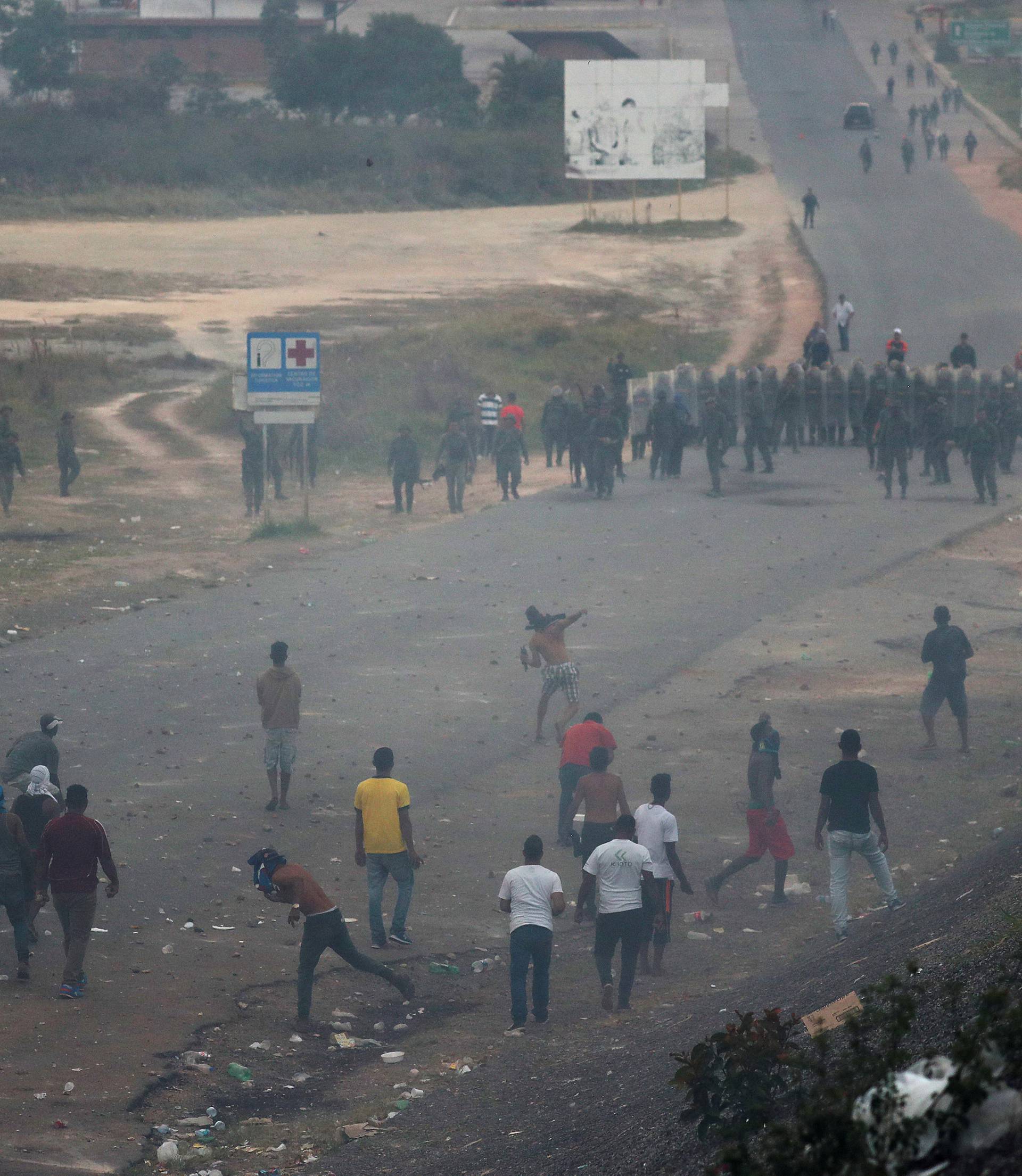 Venezuelan soldiers clash with protesters along the border between Venezuela and Brazil in Pacaraima