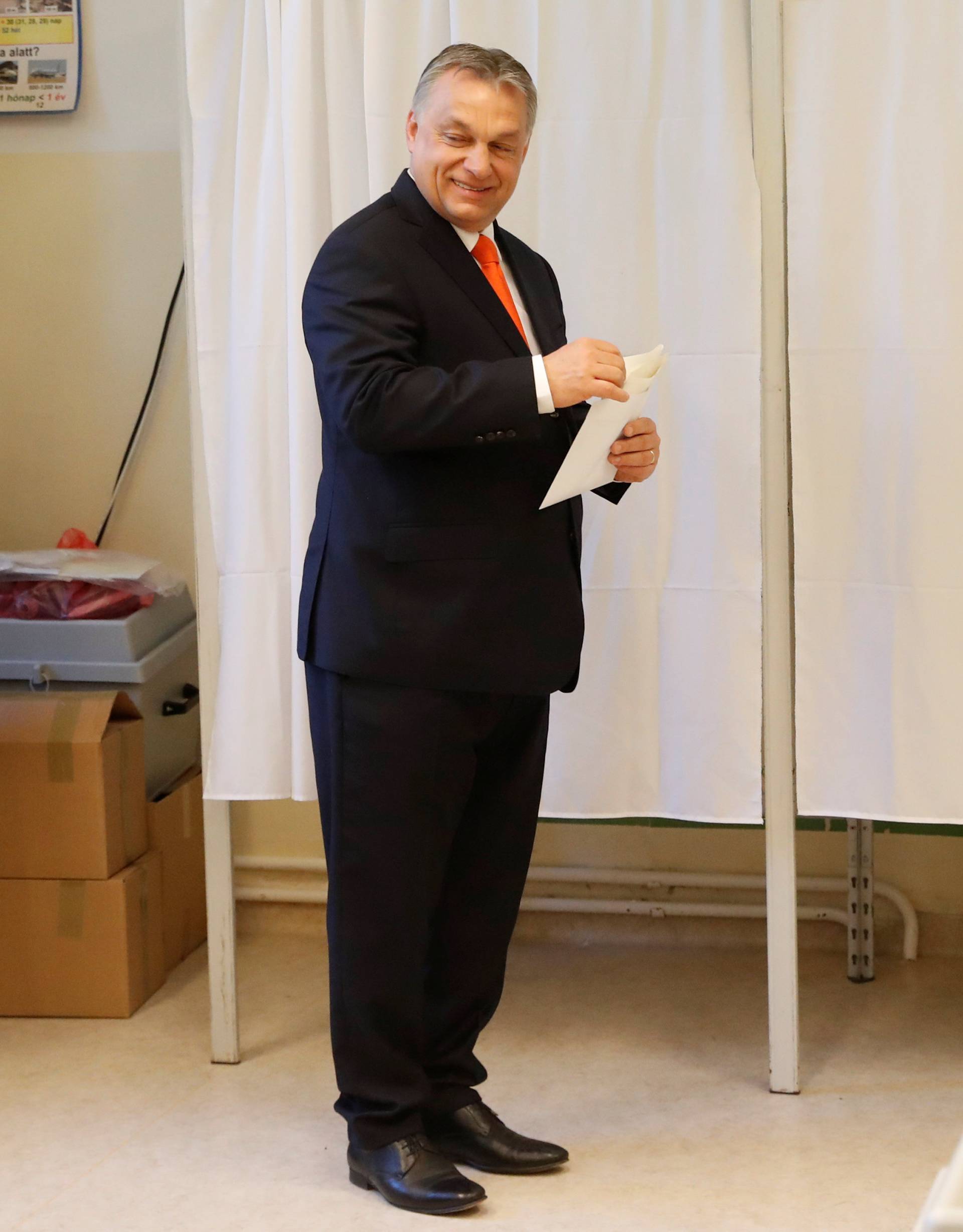 Current Hungarian Prime Minister Viktor Orban leaves a polling booth to cast his ballot during Hungarian parliamentary election in Budapest