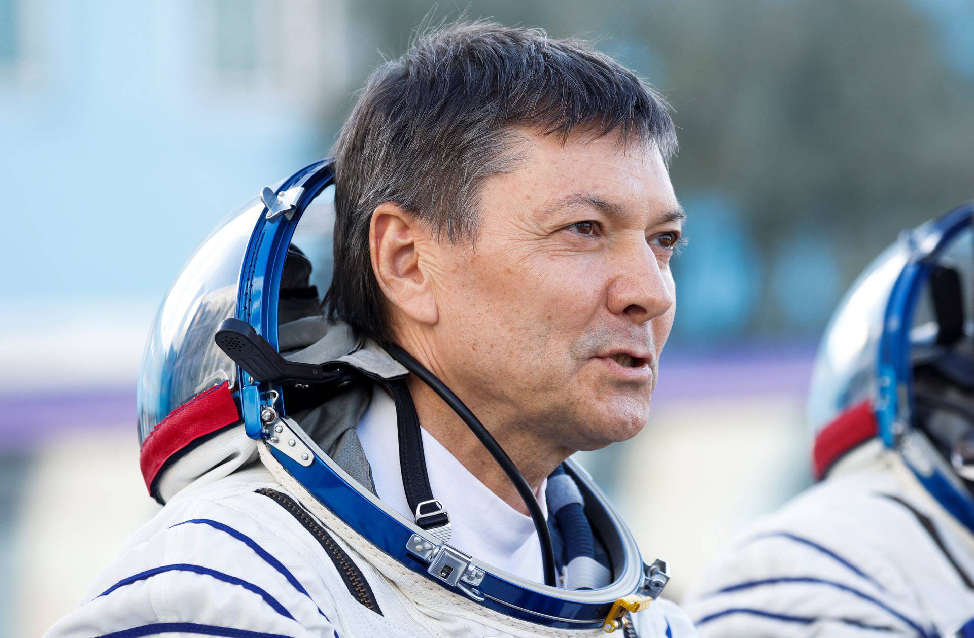 Roscosmos cosmonaut Kononenko looks on before the departure to the launchpad at the Baikonur Cosmodrome