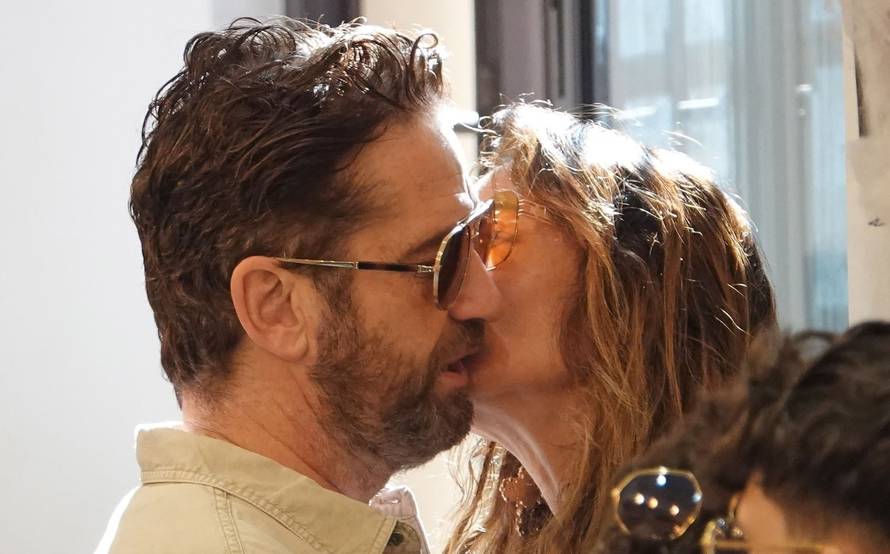 *EXCLUSIVE* Hollywood Actor Gerard Butler puts on an amorous display with girlfriend Morgan Brown enjoying their Roman Holidays.
