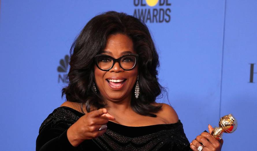 FILE PHOTO: Oprah Winfrey with her Cecil B. DeMille Award at the 75th Golden Globe Awards in Beverly Hills