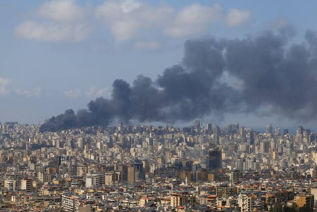Smoke rises following an Israeli strike on the southern suburbs of Beirut